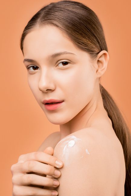 Close-up of two natural bar soaps on a white powdered surface, emphasizing hygiene.